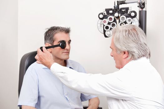 Man taking an eyesight test examination