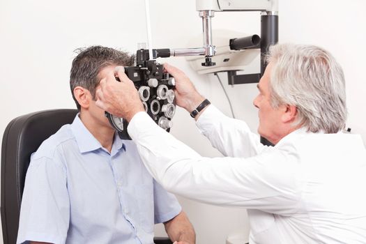 Optometrist doing sight testing for pateient