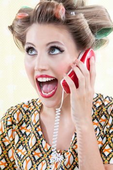 Portrait of funny surprised woman using telephone.