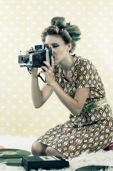 Woman  taking photograph from vintage 4x6 film camera .