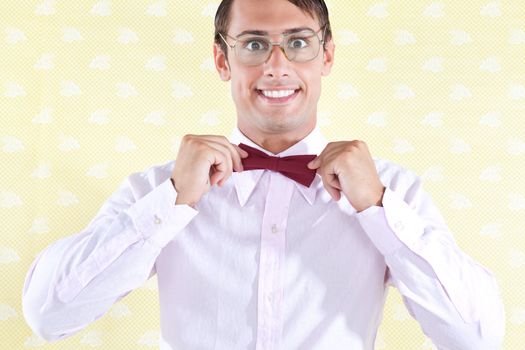 Nerd styled man adjusting bow tie