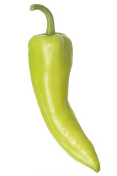 Single Banana Pepper isolated against a white background