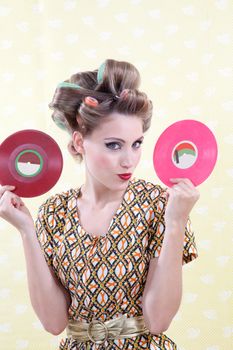 Portrait of retro woman holding LP records.