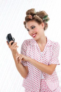 Retro styled woman taking self portrait with 35mm point and shoot camera