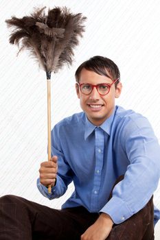 Portrait of retro male holding feather duster