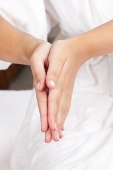 Detail of female hands while relaxing and meditating