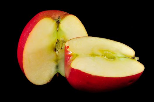 sliced apples on black background