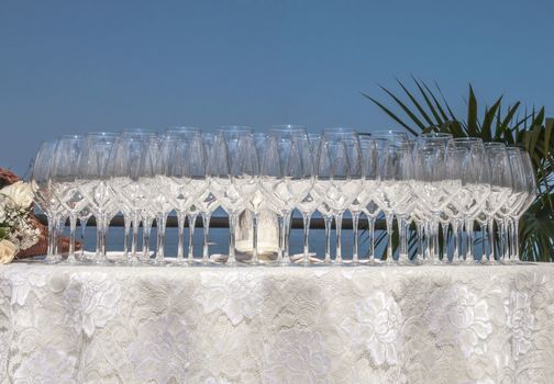 Group of crystal glasses on wedding catering table