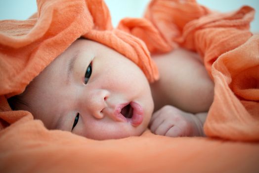 Newborn Asian baby girl awake, 7 days after birth