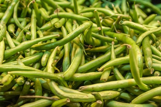 Freshly harvested green beans on display at the farmers market