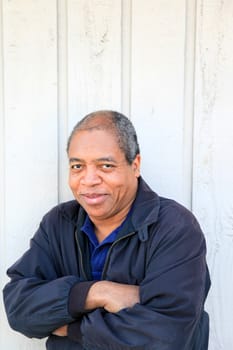 African American male posing outside.