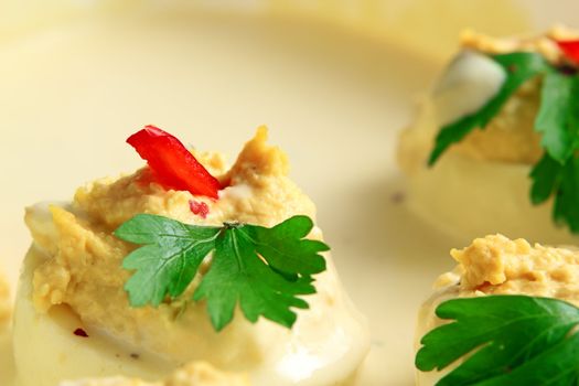 stuffed eggs with mayonnaise and green parsley