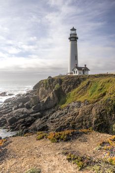 HDR landscape of Pigeon Point Lighthouse with dramatic clouds. Located on the northern coast of California