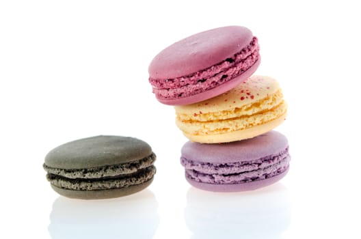  french macaroons stack  over  white with reflection