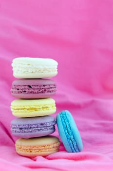   french macaroons  stack on  pink fabric background