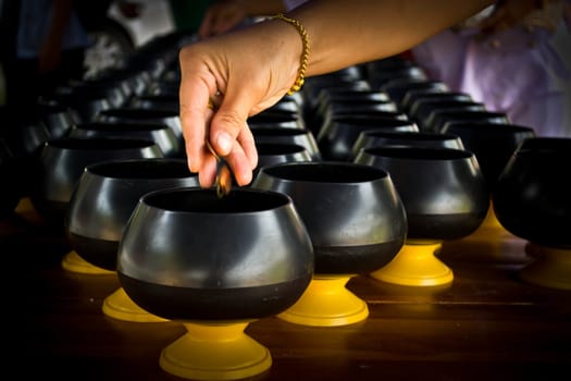 Women coin operated Down in alms bowl, successive in job the way religion Buddhist
