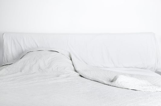 White doube bed in the bedroom