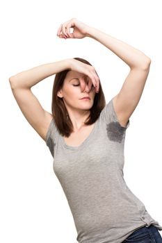Woman sweating very badly under armpit and holding nose