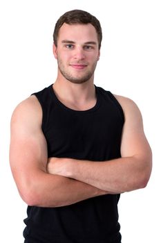 Young sport man in black tank top smiling into camera