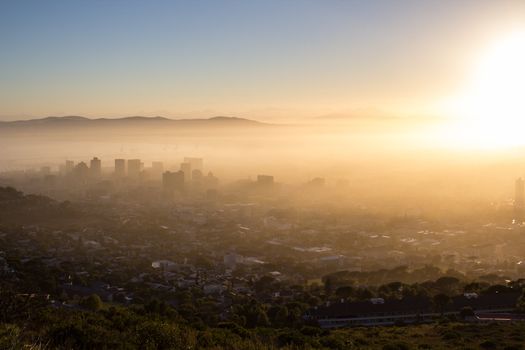 Photo Of Cape Town On A Misty Morning With Buildings Looking Through The Fog