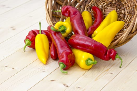 red and yellow peppers in a basket