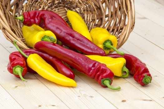 red and yellow peppers in a basket