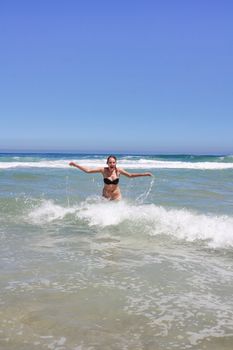 Woman standing in indian ocean in south africa