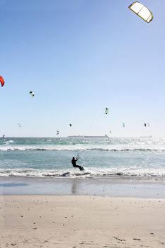 Windsurfers Kitesurfers at the milnerton beach in cape town