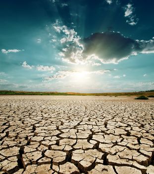 dramatic sunset over drought land