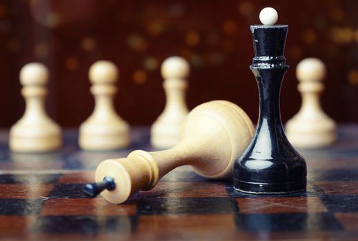 Close-up photo of the chessboard with chessmen. Shallow depth of field for natural view