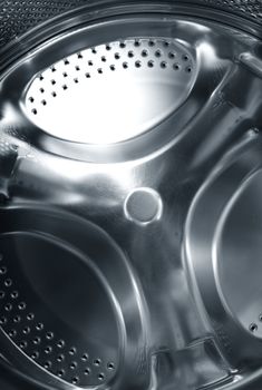 Metal circular element of washing machine. Close-up photo