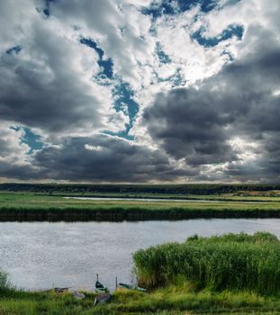 dramatic clouds and river