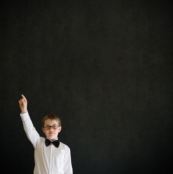 Education school boy hands up answering question on blackboard