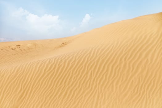 View on the rippled sand dunes in the desert. Natural light and colors