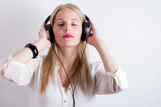 Image of Woman Listening To Music With Headphones