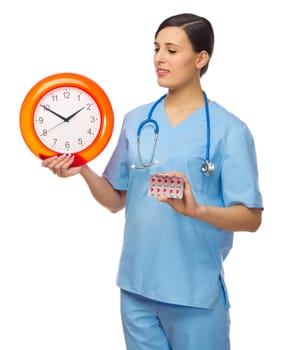 Doctor with clock and pills isolated