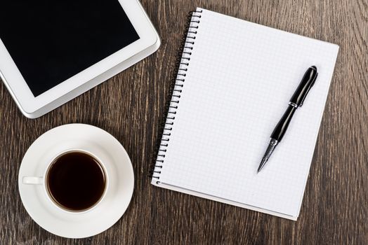 pen, coffee and tablet on the table, workplace businessman