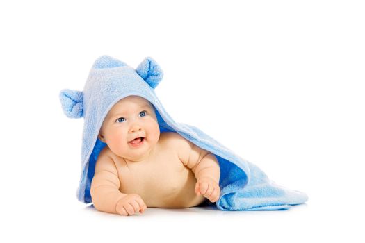 Small smiling baby with a towel