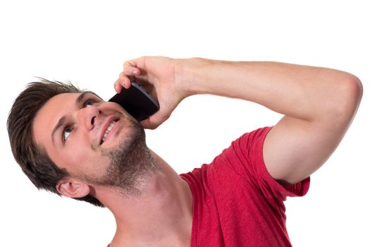 Young Man talking on the phone and looking up