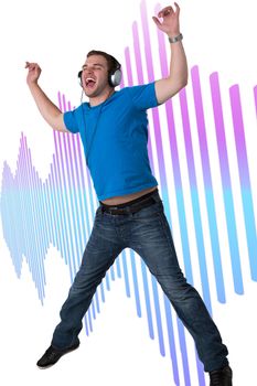 Young Man Listening to music and jumping in the air