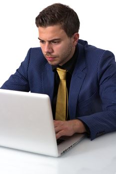 Young Businessman in a Blue suit Working on He's Notebook