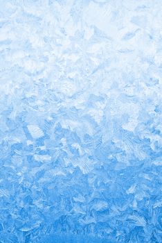 Light blue frozen window glass background