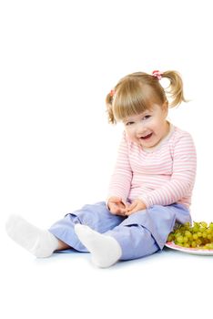Little girl with grapes isolated