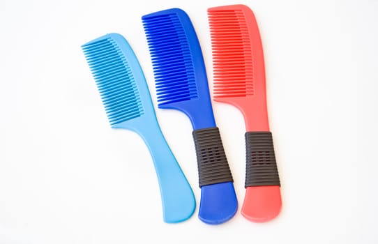 blue and red comb on white background