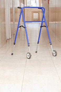 Adjustable folding walker for elderly at hospital.