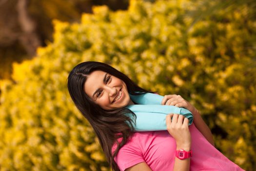 Sport woman with blue towell enjoying after fitness session