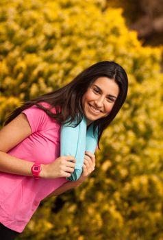 Sport woman with blue towell enjoying after fitness session