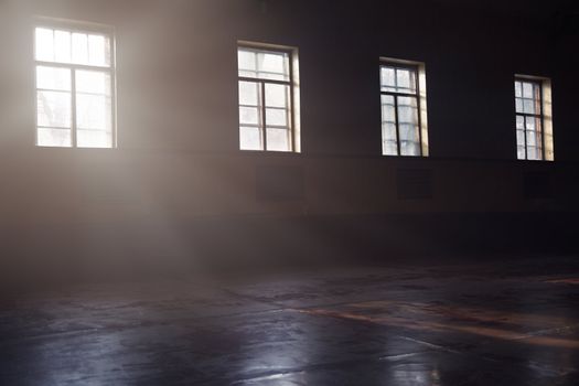 Dark interior with sunlight from the windows