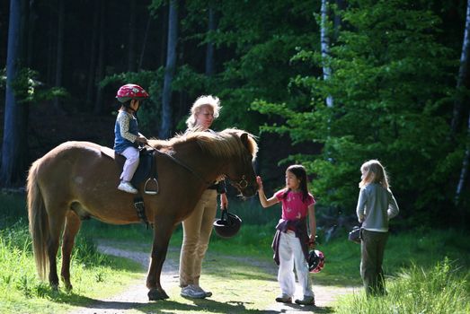 Girls on horse in a forest in denmark