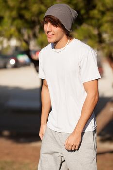 young handsome man jogging in public park